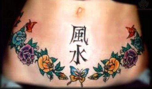 Flowers And Kanji Symbol Tattoo On Belly